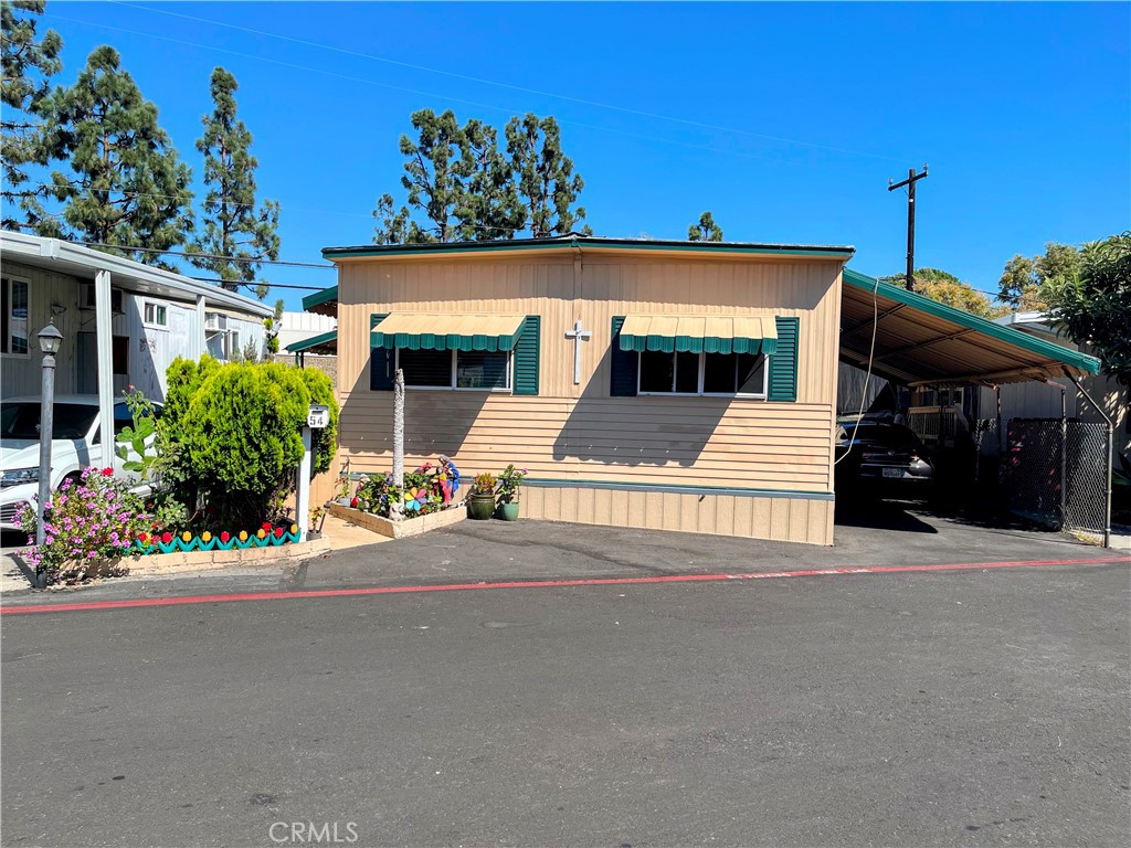 13102 Partridge Street, Unit 54 Garden Grove, CA 92843 - Photo 1 of 4 a view of a house with a patio