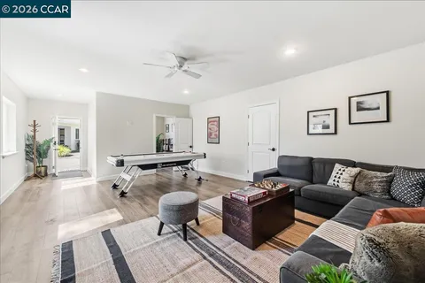 a spacious bedroom with a bed and a couch