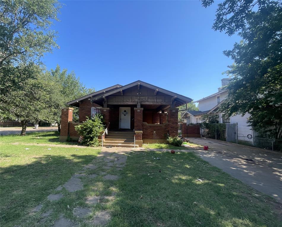 a view of a house with a yard porch and sitting area
