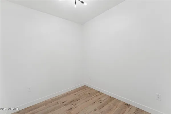 a view of a small space with wooden floor