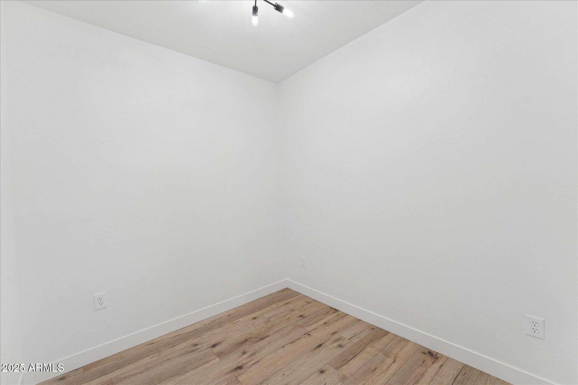 3434 East Baseline Road, Unit 265 Phoenix, AZ 85042 - Photo 12 of 19 a view of a small space with wooden floor