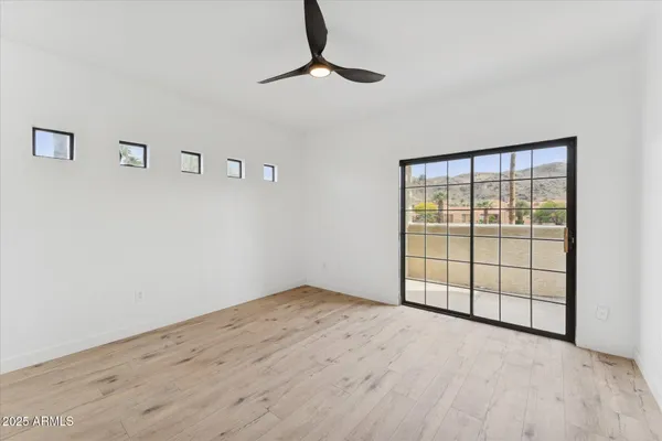 a view of an empty room with a window