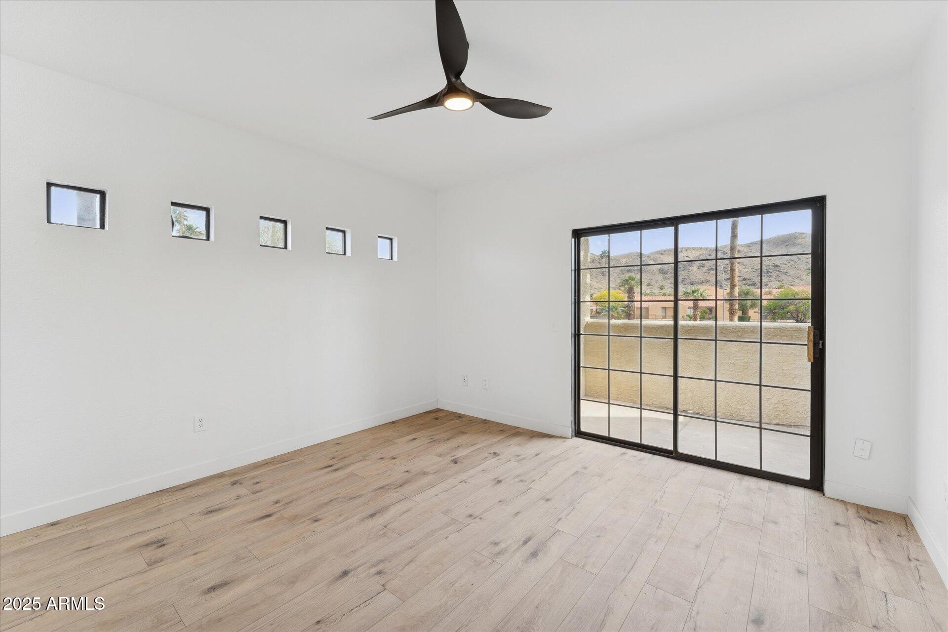 3434 East Baseline Road, Unit 265 Phoenix, AZ 85042 - Photo 3 of 19 a view of an empty room with a window