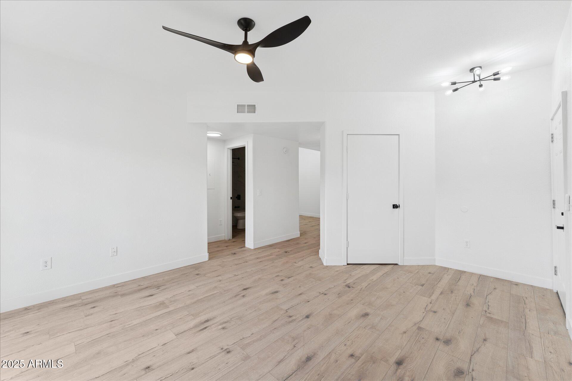 3434 East Baseline Road, Unit 265 Phoenix, AZ 85042 - Photo 6 of 19 wooden floor in an empty room