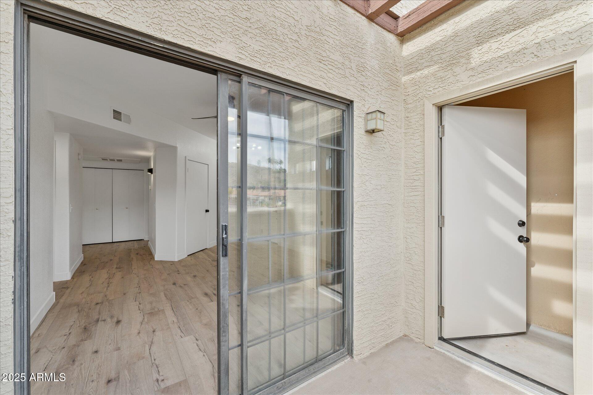 3434 East Baseline Road, Unit 265 Phoenix, AZ 85042 - Photo 8 of 19 a bathroom with a glass shower door