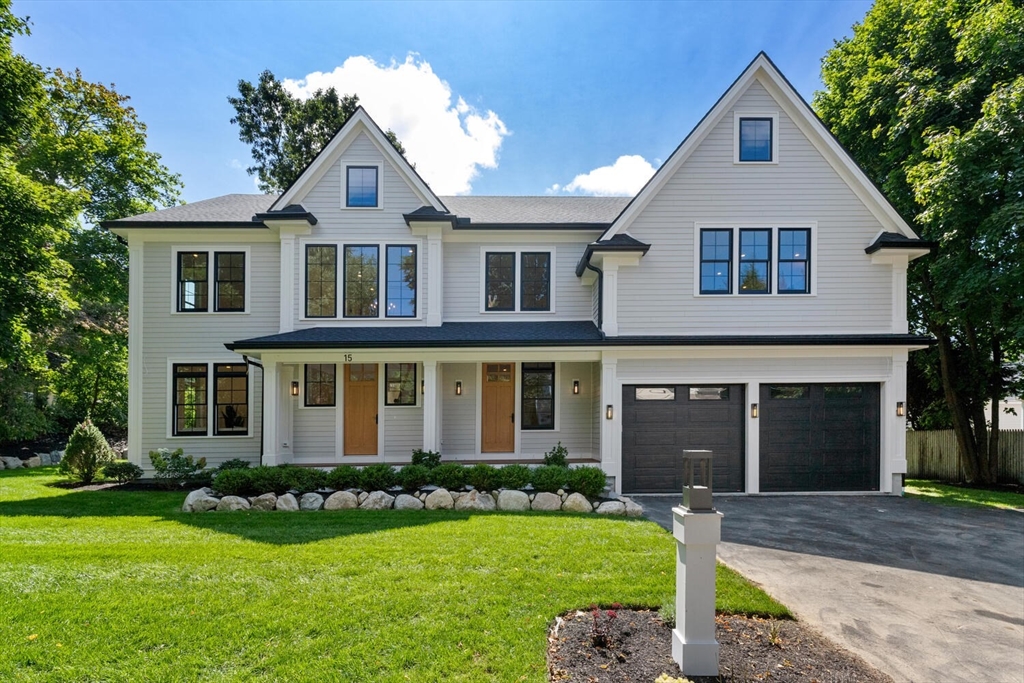 15 West Chardon Road Winchester, MA 01890 - Photo 3 of 42 a front view of a house with a yard and garage