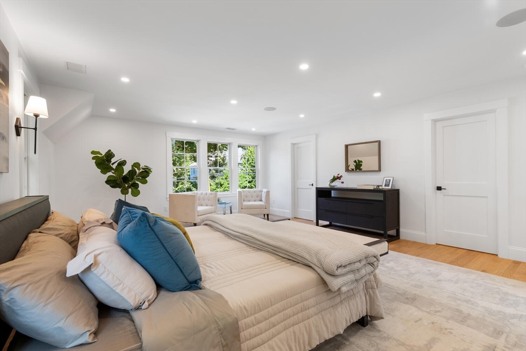 15 West Chardon Road Winchester, MA 01890 - Photo 31 of 42 a spacious bedroom with a bed window and couch