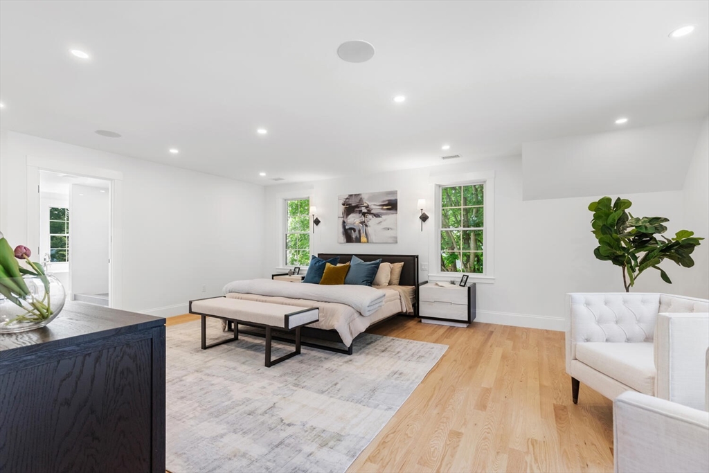 15 West Chardon Road Winchester, MA 01890 - Photo 32 of 42 a spacious bedroom with a bed and a couch