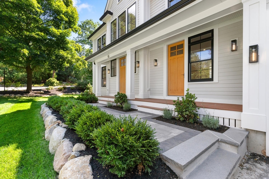 15 West Chardon Road Winchester, MA 01890 - Photo 5 of 42 a front view of a house with garden and porch