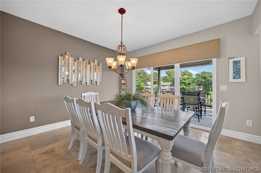51 Arrowhead Beach Road Lake Ozark, MO 65049 - Photo 10 of 68 Dining room to upper deck