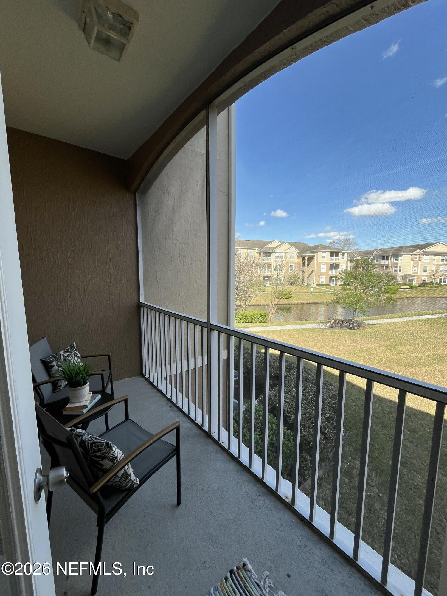 7990 Baymeadows Road East, Unit 907 Jacksonville, FL 32256 - Photo 17 of 19 Screened Balcony Overlooks Pond