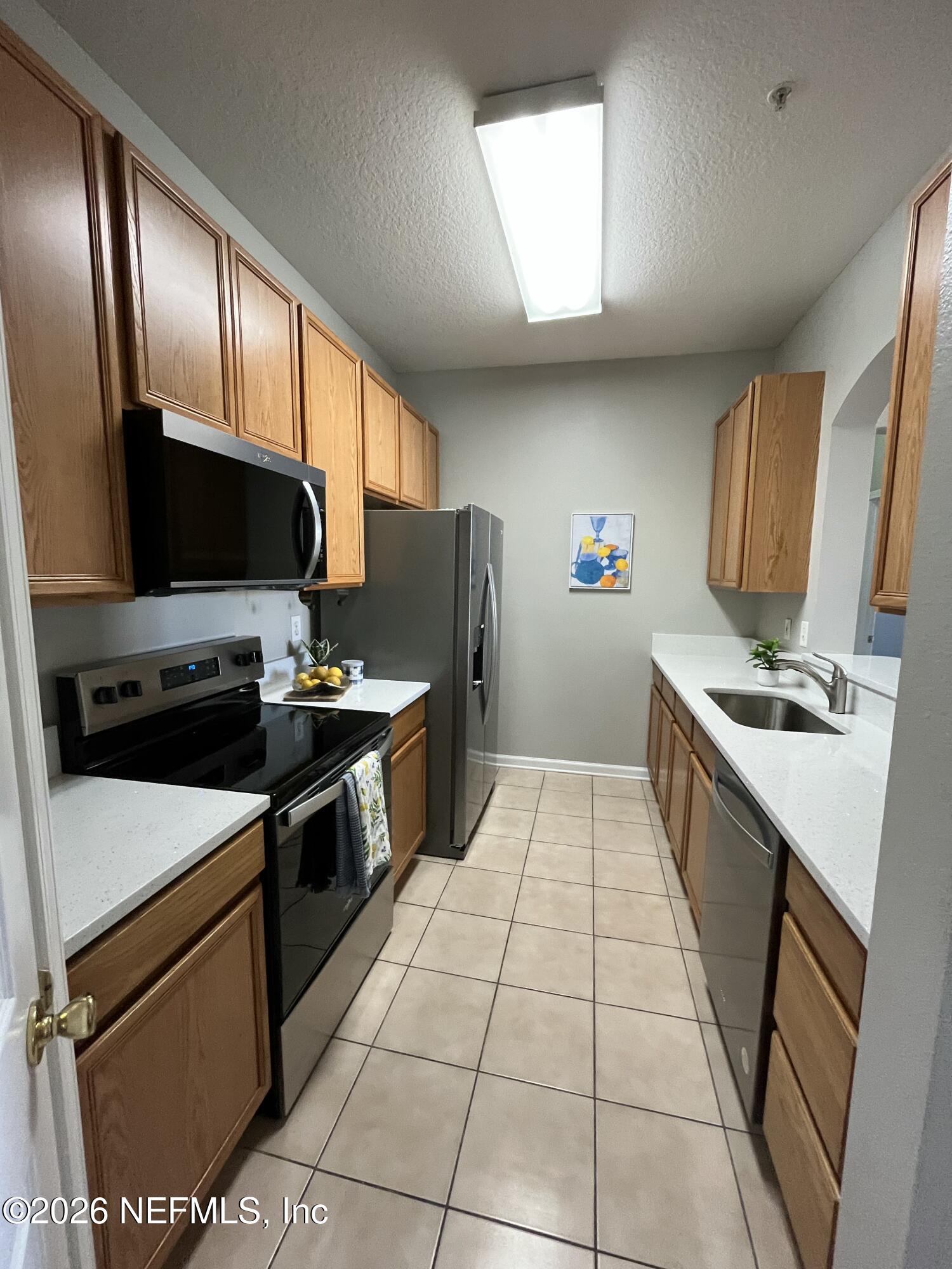 7990 Baymeadows Road East, Unit 907 Jacksonville, FL 32256 - Photo 8 of 19 Kitchen 2
