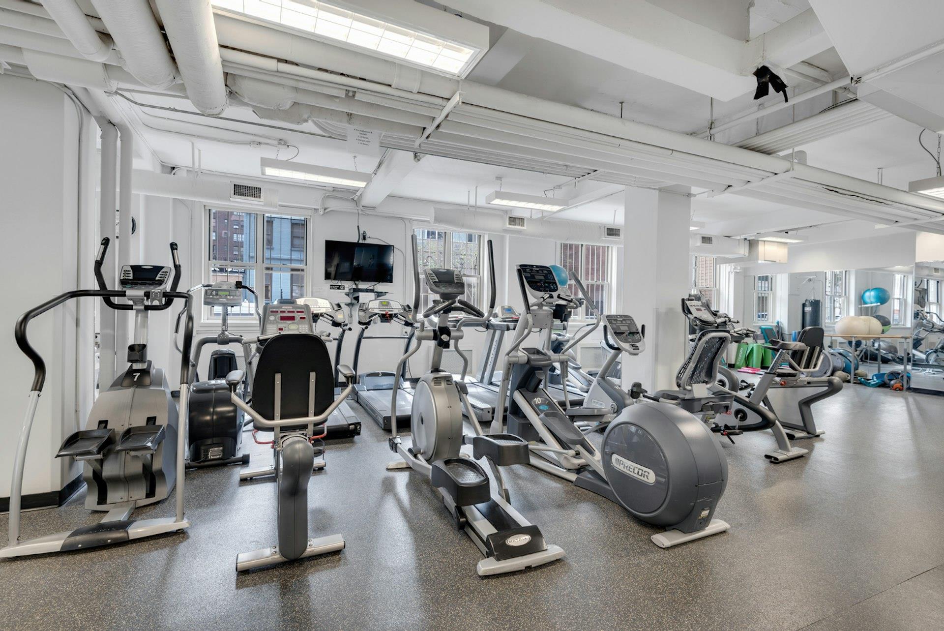 415 East 52nd Street, Unit 4D Manhattan, NY 10022 - Photo 14 of 21 a view of a room with gym equipment