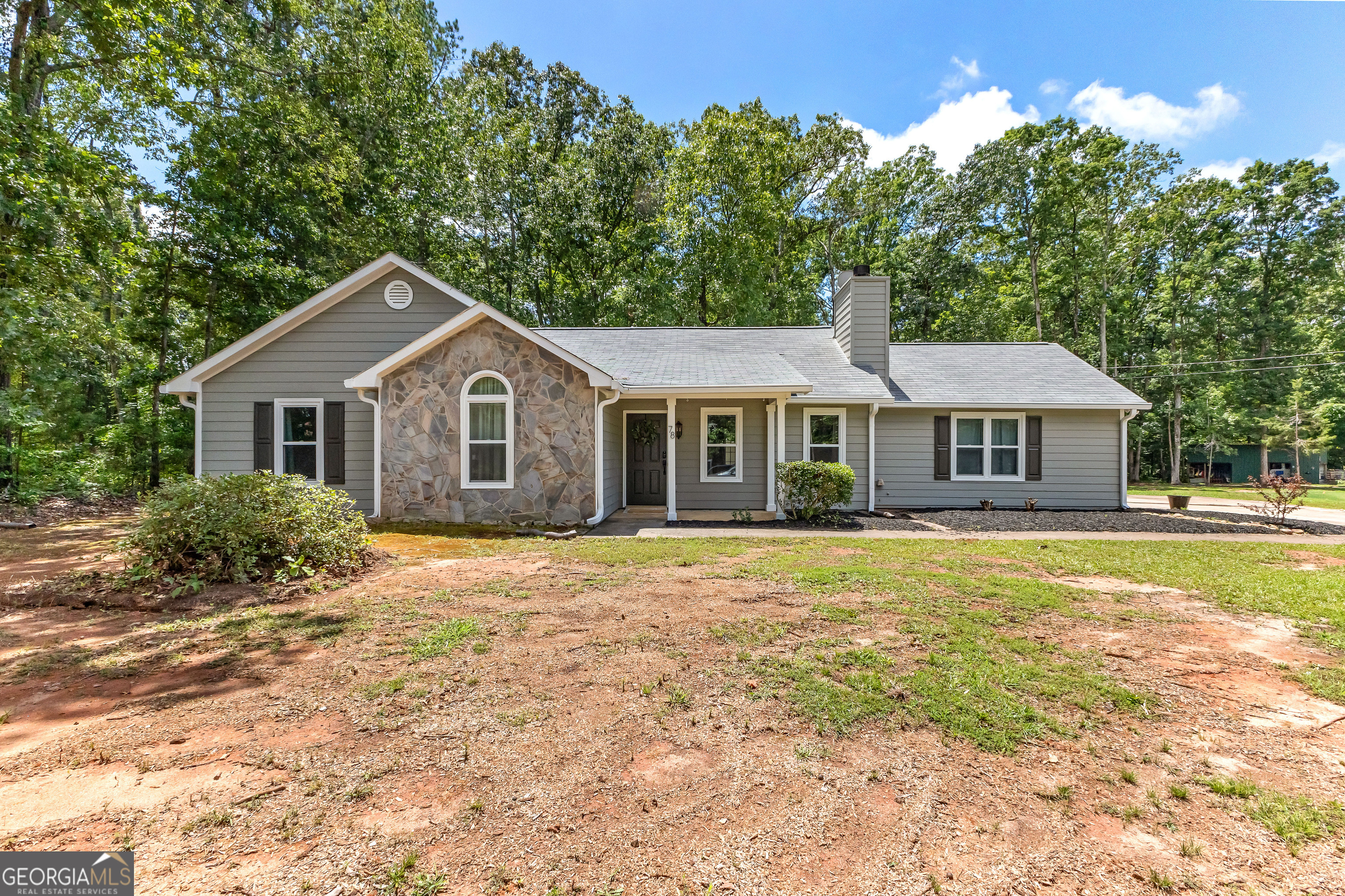 78 Standing Rock Road Senoia, GA 30276 - Photo 1 of 1 a front view of a house with a garden