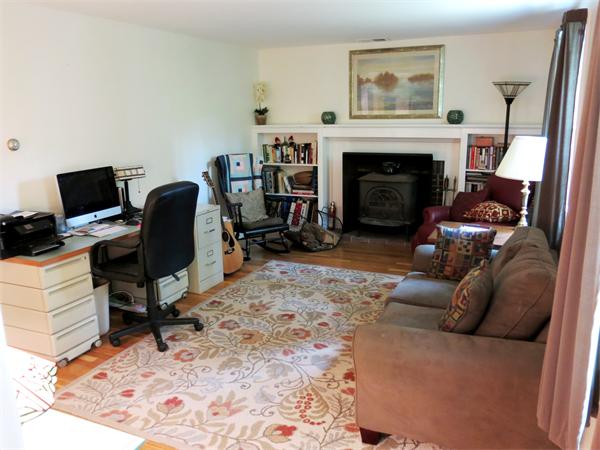 167 Bare Hill Road Boxford, MA 01921 - Photo 13 of 28 a living room with furniture a fireplace and a flat screen tv