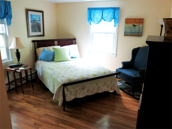 167 Bare Hill Road Boxford, MA 01921 - Photo 18 of 28 a bedroom with a bed and wooden floor
