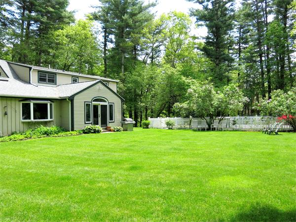167 Bare Hill Road Boxford, MA 01921 - Photo 21 of 28 a front view of a house with a yard