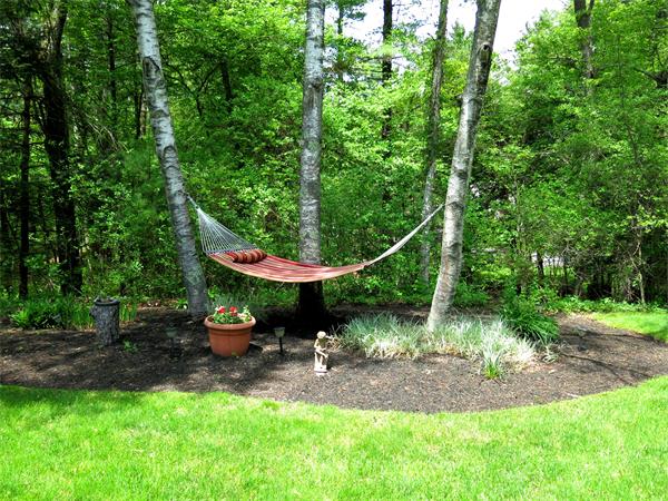 167 Bare Hill Road Boxford, MA 01921 - Photo 22 of 28 a view of a table and chairs in the garden