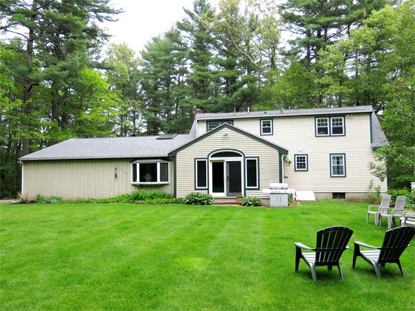 167 Bare Hill Road Boxford, MA 01921 - Photo 3 of 28 a front view of a house with a yard and trees