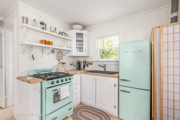 a kitchen with stainless steel appliances granite countertop a stove and a sink