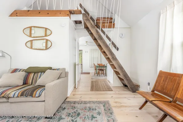 a living room with furniture and a rug