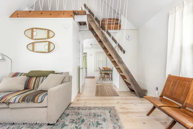 a living room with furniture and a rug