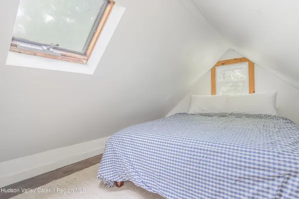 a view of a living room with a fireplace