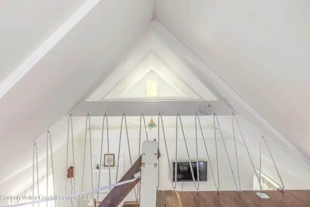 a view of a house with a yard and a wooden deck