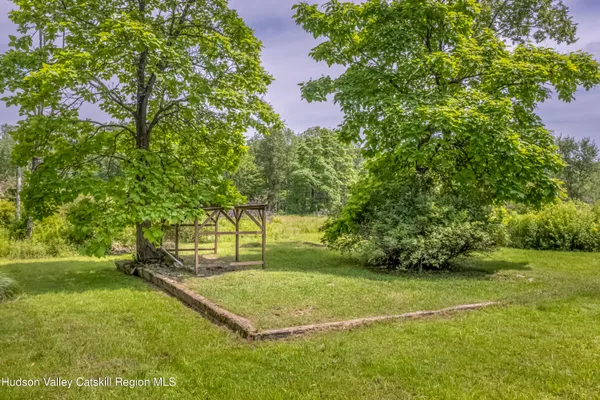 an aerial view of a house with yard
