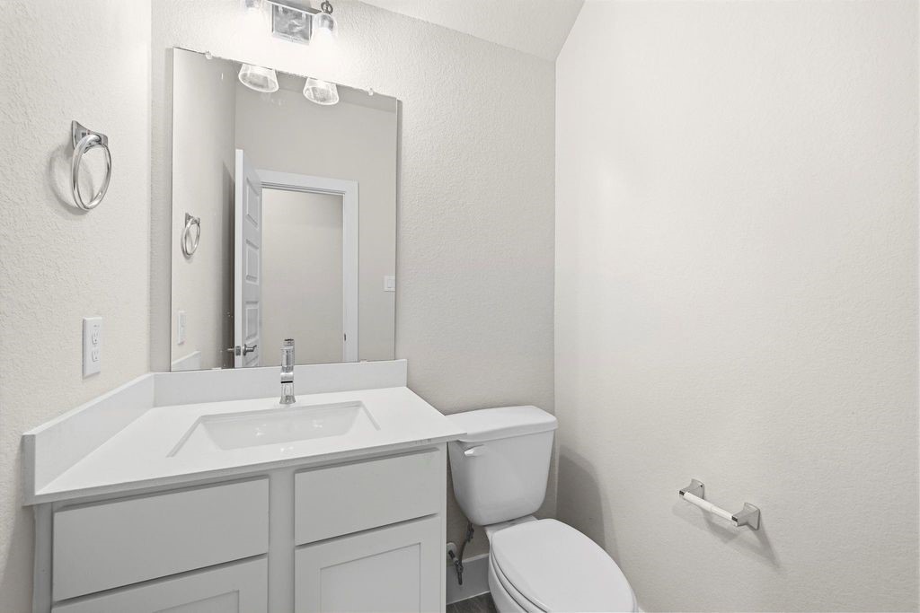 1972 Golden Spruce Lane Conroe, TX 77301 - Photo 15 of 19 a bathroom with a sink mirror vanity and toilet