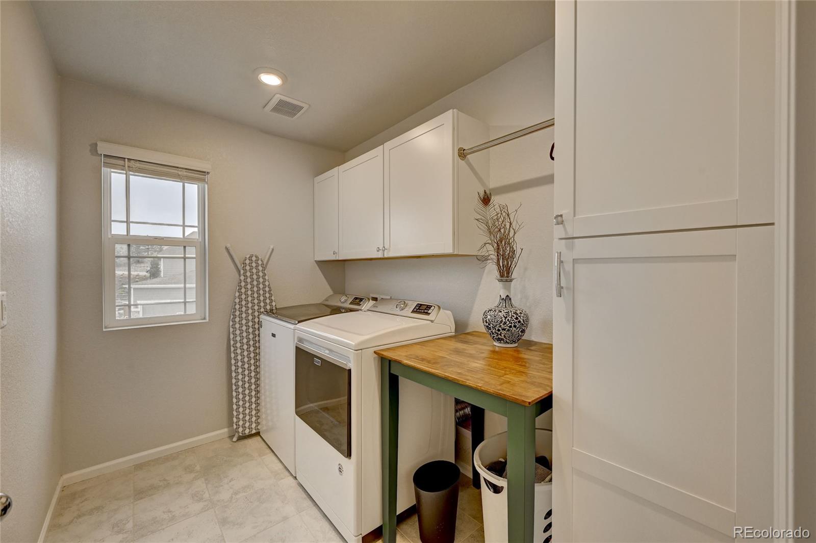 7203 Bedlam Drive Castle Pines, CO 80108 - Photo 24 of 39 a utility room with dryer and washer