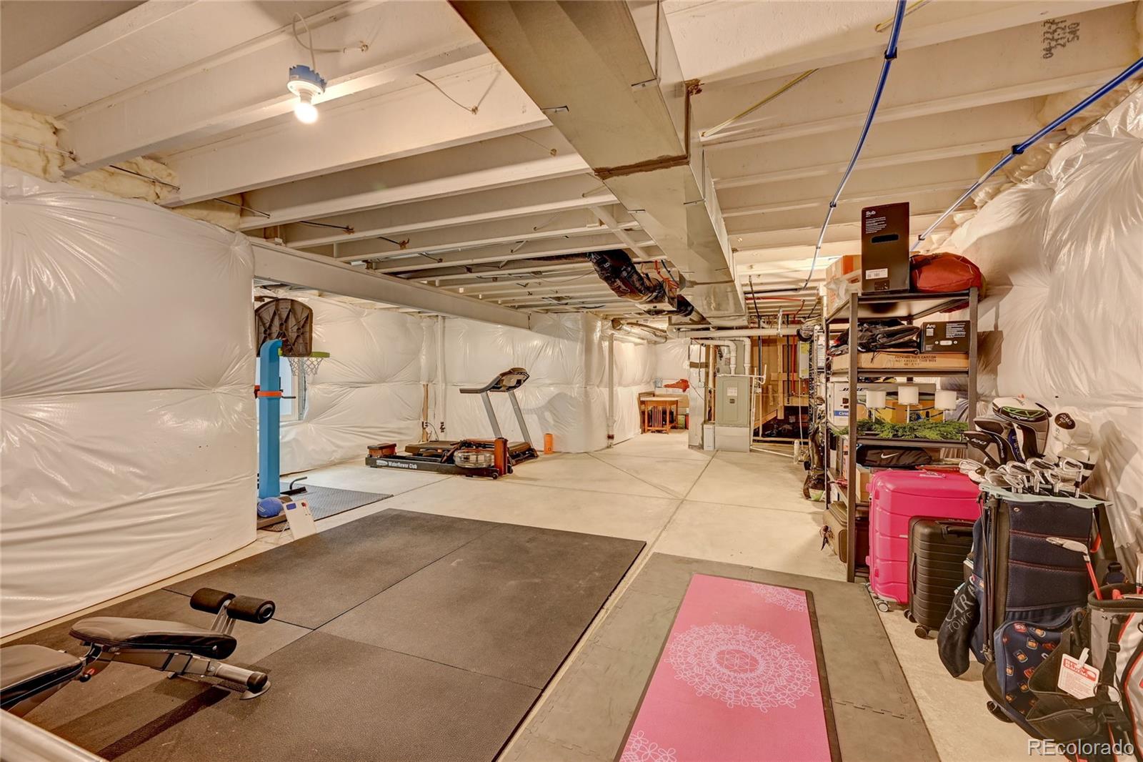 7203 Bedlam Drive Castle Pines, CO 80108 - Photo 31 of 39 a view of a room with gym equipment