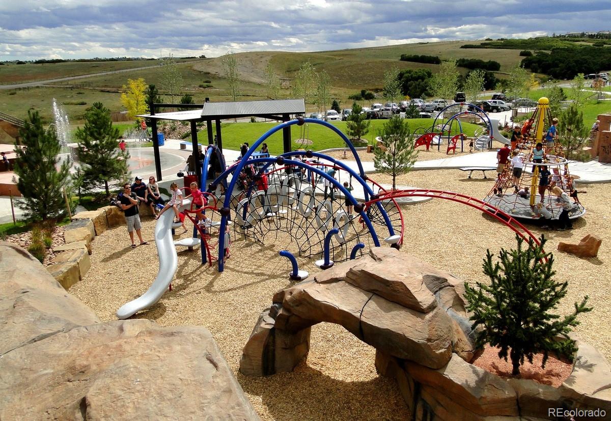 7203 Bedlam Drive Castle Pines, CO 80108 - Photo 37 of 39 a view of a swimming pool with a patio