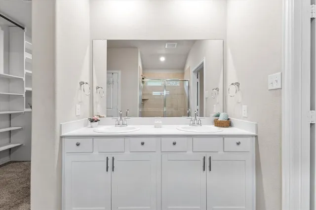 a view of walk in closet and stairs