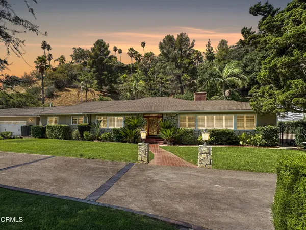 a view of a big yard next to a house