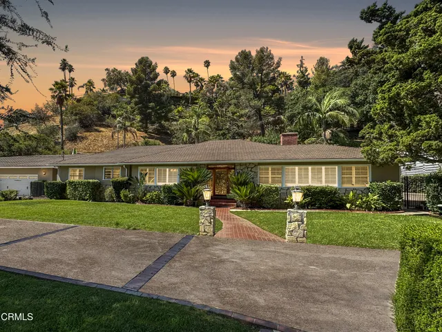 a view of a big yard next to a house