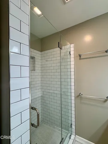 a bathroom with a sink a mirror and a light fixture