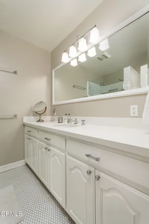a bathroom with a sink and a mirror