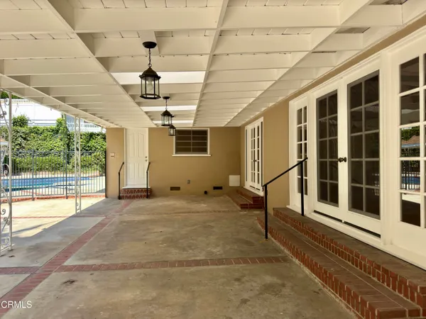 a view of a swimming pool with chairs