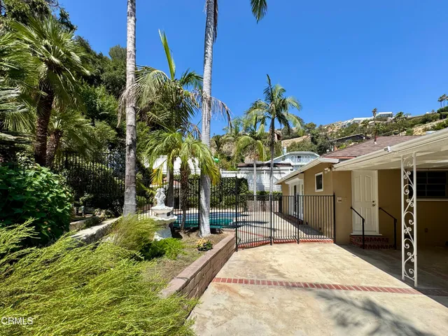 a house with trees in the background