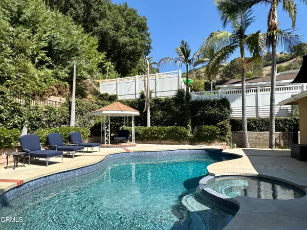 a view of a house with a yard and plants