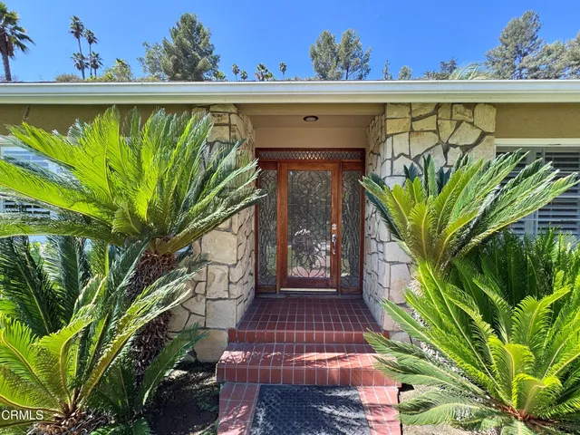 a view of a garden with a fountain