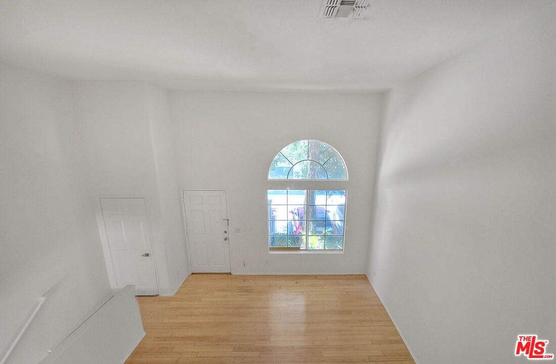8741 Darby Avenue, Unit 16 Northridge, CA 91325 - Photo 12 of 43 an empty room with windows