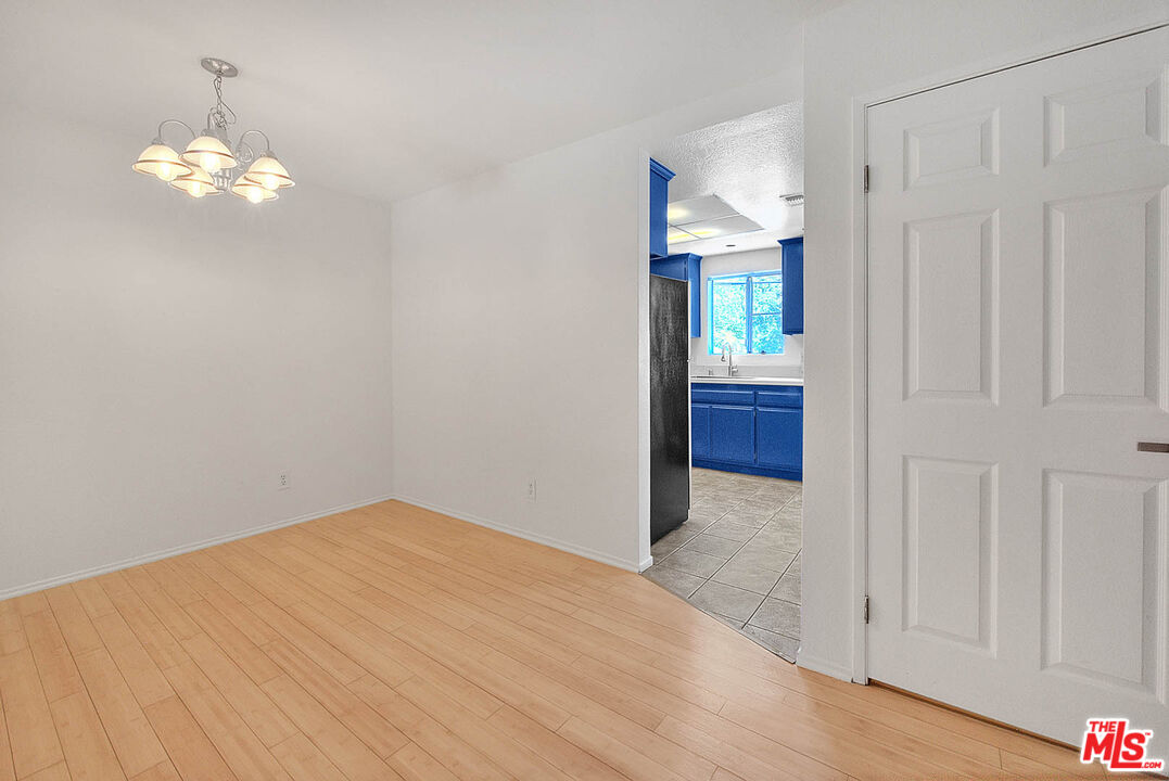 8741 Darby Avenue, Unit 16 Northridge, CA 91325 - Photo 17 of 43 wooden floor in an empty room with a window