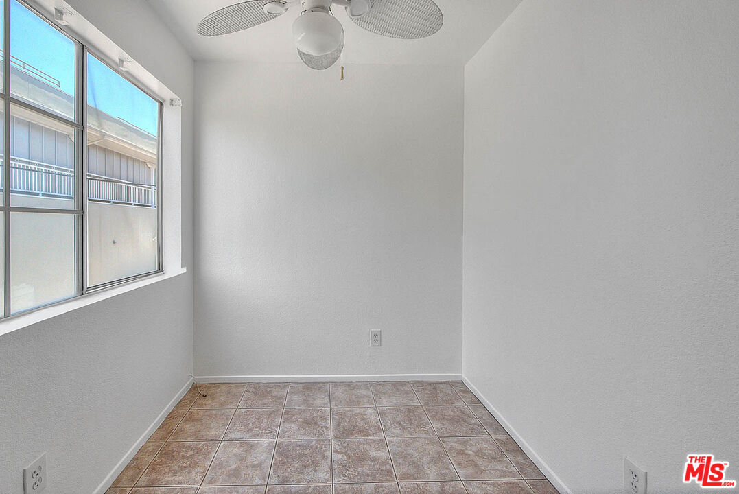 8741 Darby Avenue, Unit 16 Northridge, CA 91325 - Photo 23 of 43 a view of an empty room with a window