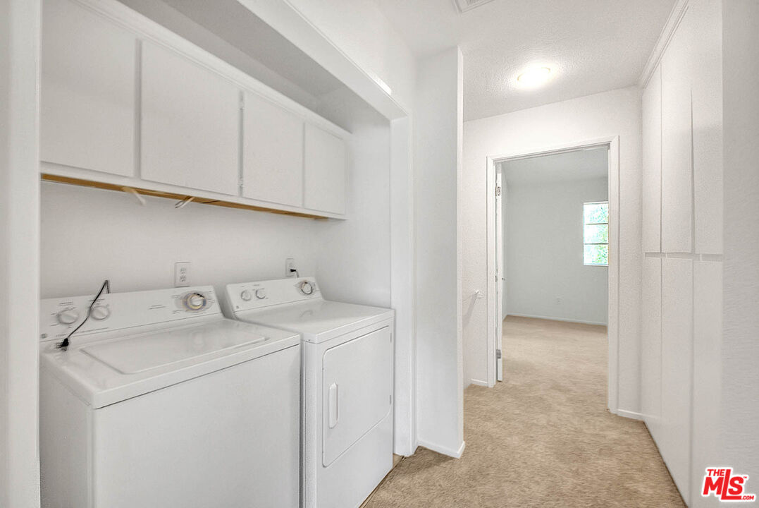 8741 Darby Avenue, Unit 16 Northridge, CA 91325 - Photo 30 of 43 a utility room with dryer and washer