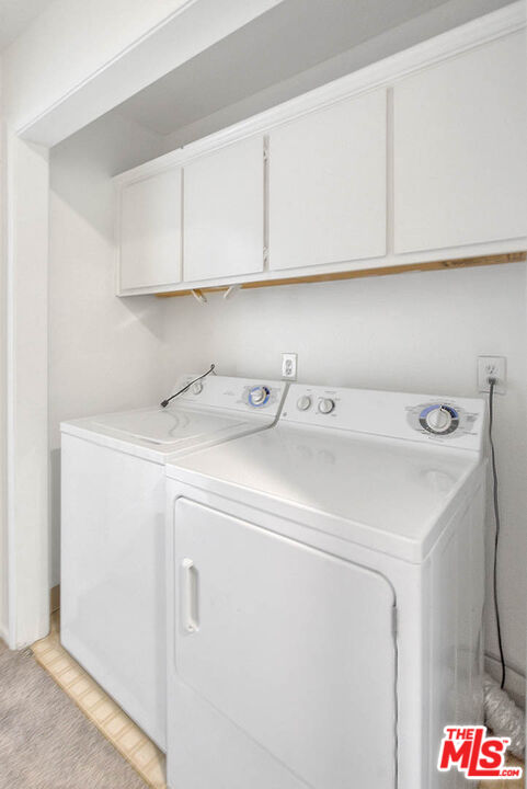8741 Darby Avenue, Unit 16 Northridge, CA 91325 - Photo 31 of 43 a utility room with dryer and washer