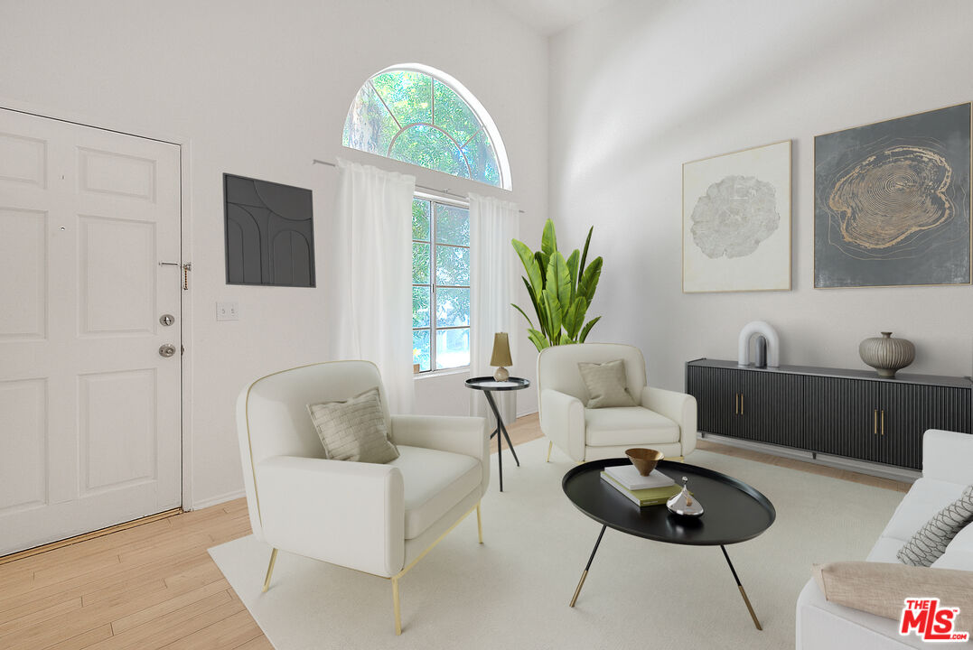 8741 Darby Avenue, Unit 16 Northridge, CA 91325 - Photo 4 of 43 a living room with furniture and a wooden floor