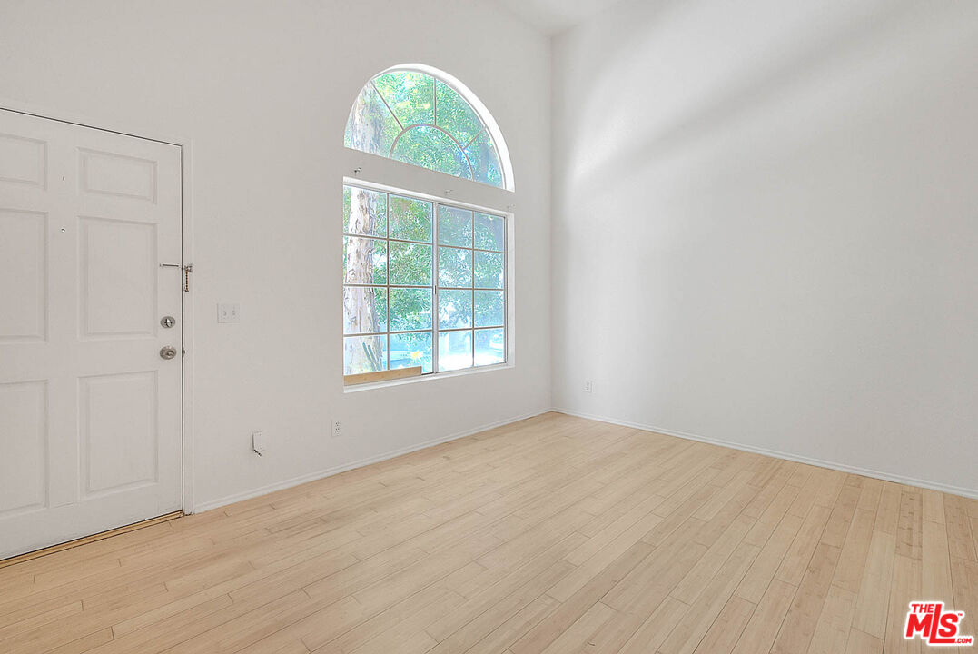 8741 Darby Avenue, Unit 16 Northridge, CA 91325 - Photo 5 of 43 an empty room with windows