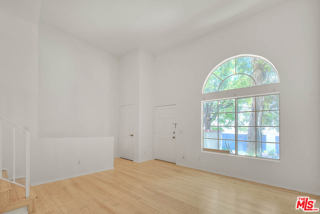 8741 Darby Avenue, Unit 16 Northridge, CA 91325 - Photo 6 of 43 an empty room with a window